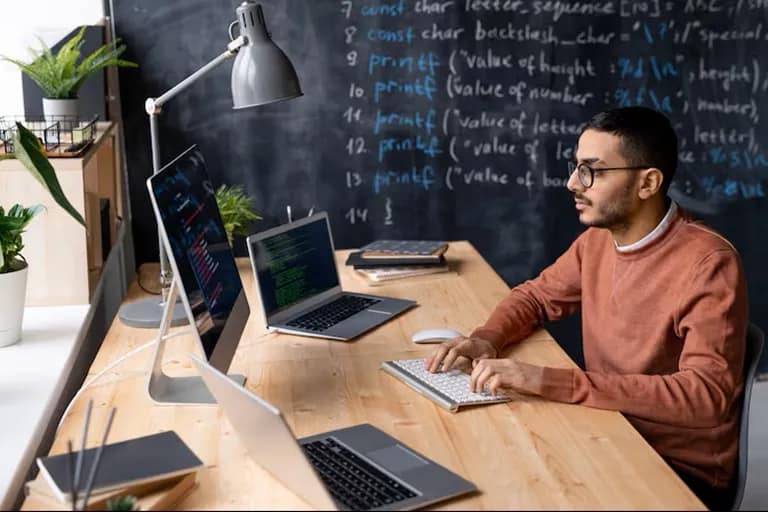 Student working on software development projects during a BCA course
