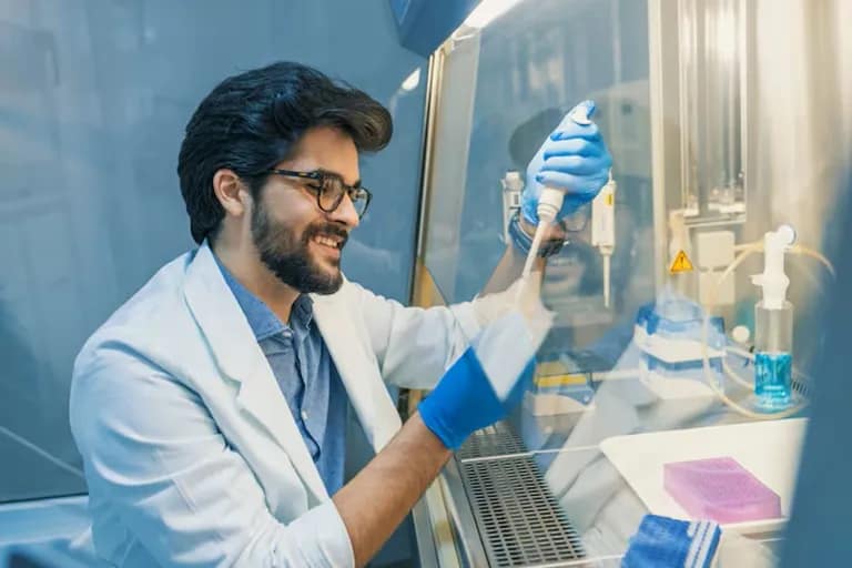 MSc student performing laboratory research with advanced scientific equipment